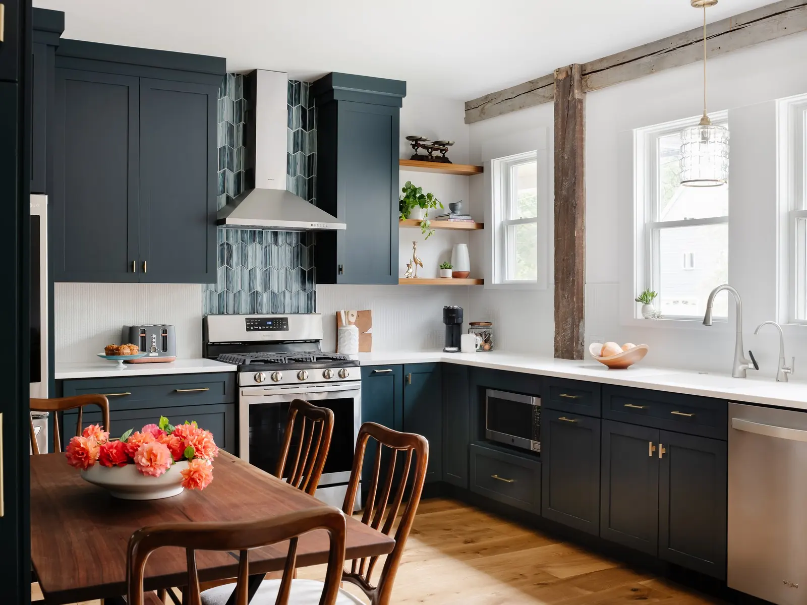 Kitchen with deep blue cabinetry, a rustic wood post and open shelves